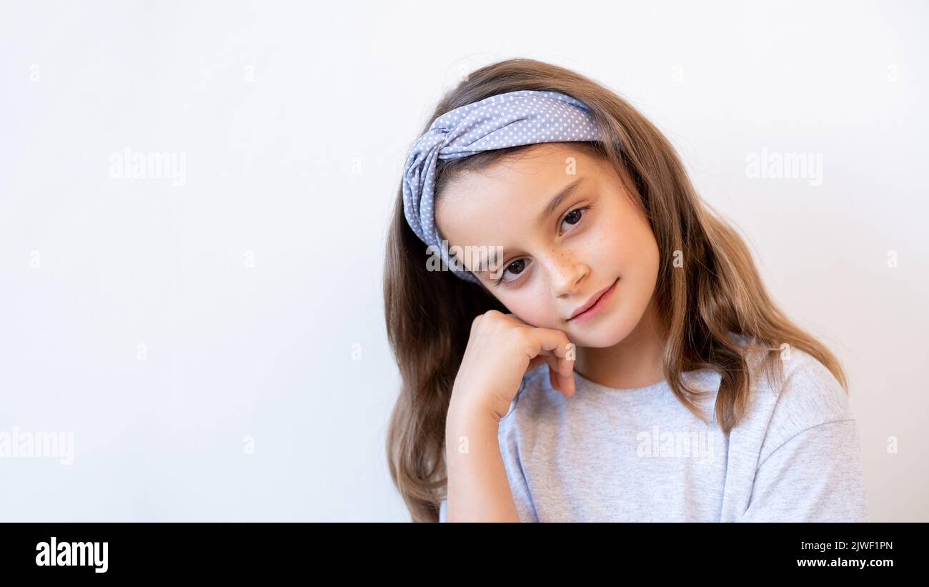 thoughtful kid portrait daydreaming cute girl face Stock Photo