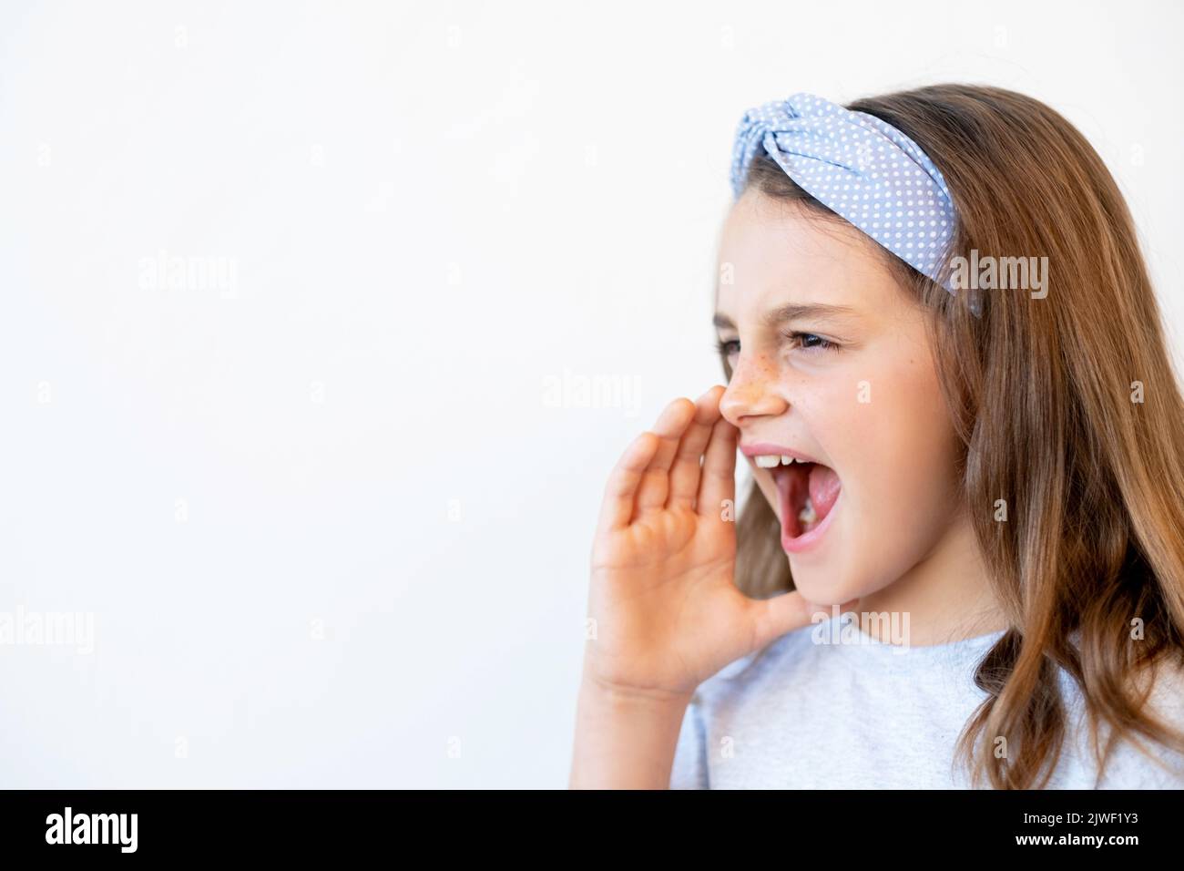 child announcement excited small girl shouting Stock Photo