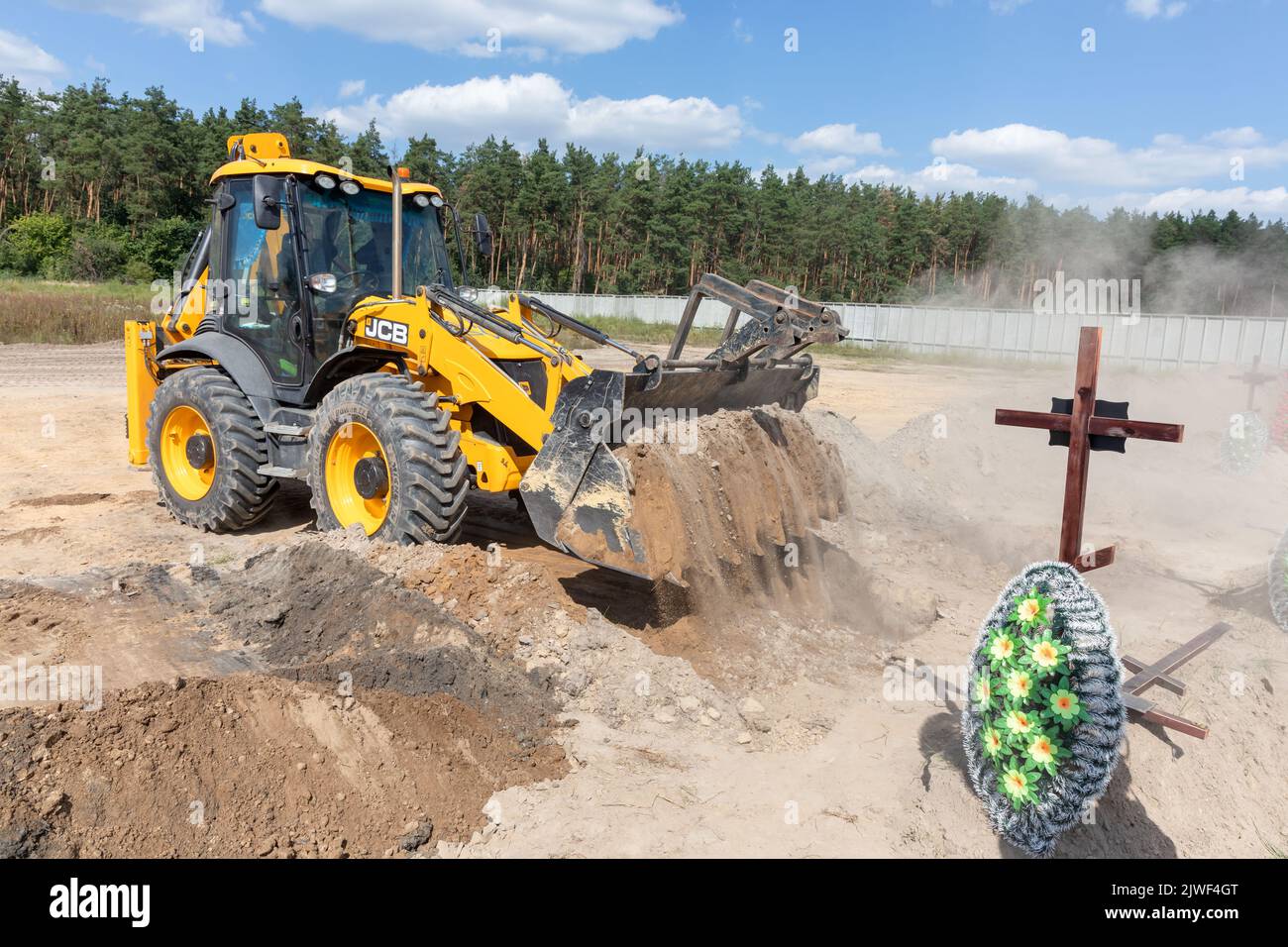 Bucha, Ukraine. 2nd Sep, 2022. An excavator is seen digging fresh