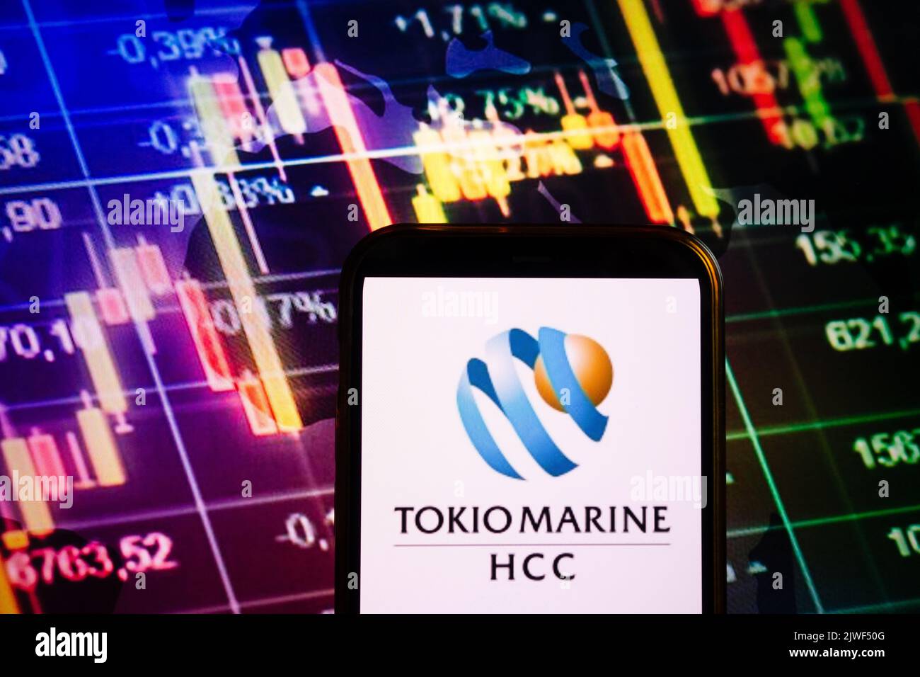 KONSKIE, POLAND - September 04, 2022: Smartphone displaying logo of Tokio Marine company on stock exchange diagram background Stock Photo