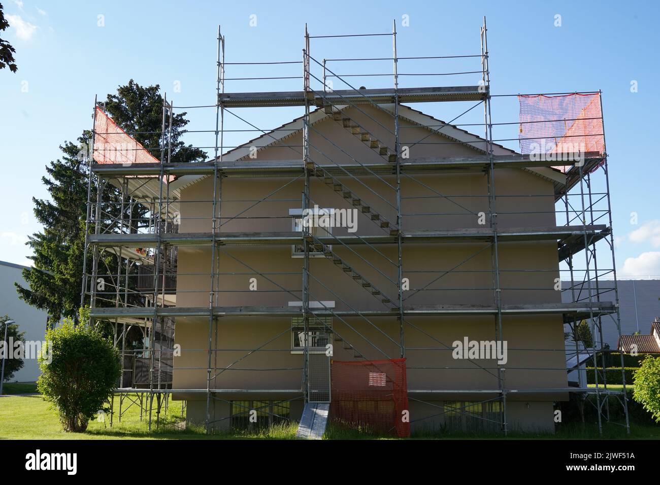 Residential apartment house in Switzerland with scaffolding and