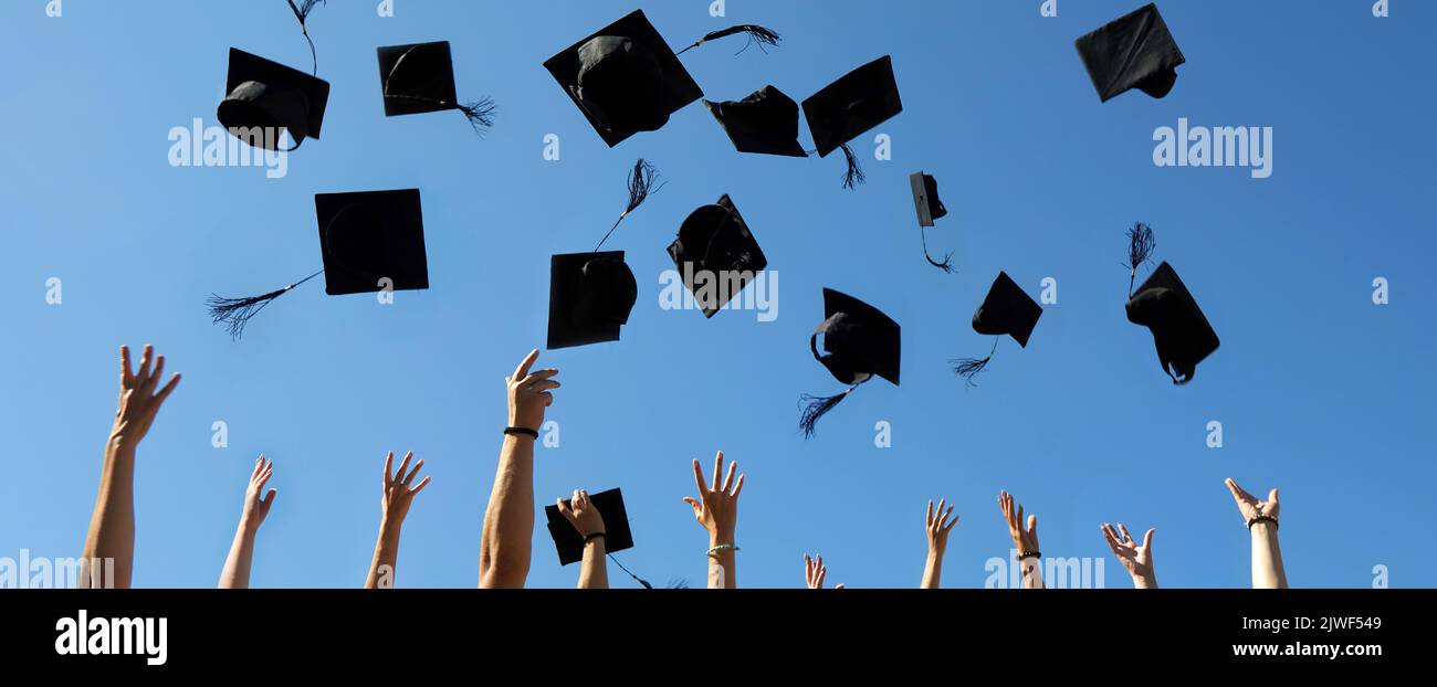 Graduation Caps Thrown in the Air on blue sky Stock Photo Alamy