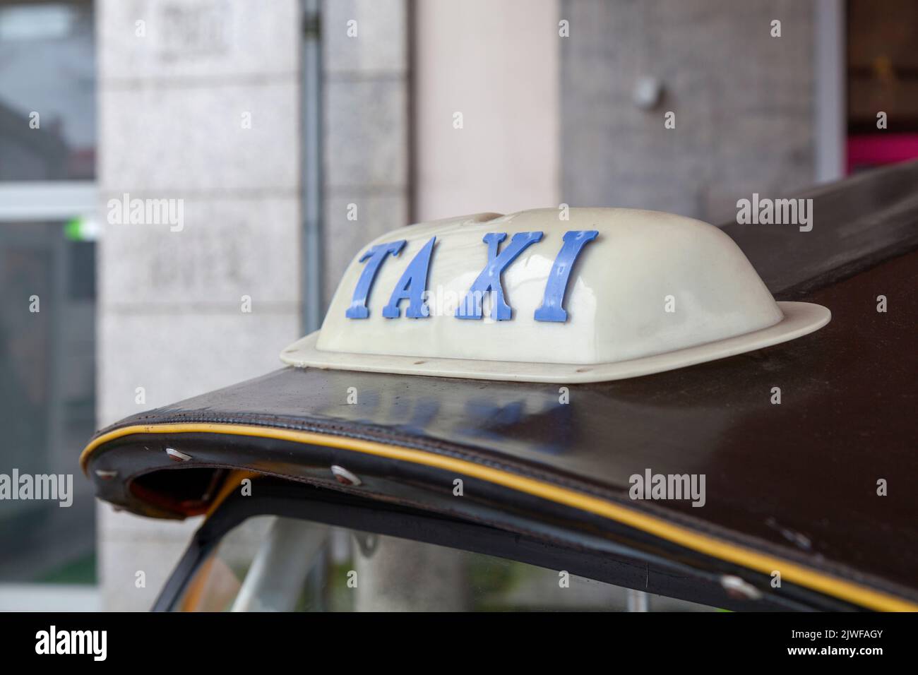Taxi sign on the roof of a tuk tuk in Bangkok, Thailand. Stock Photo
