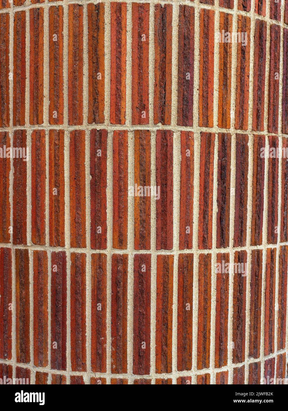 Bricks with mortar on a curved wall background abstract Stock Photo