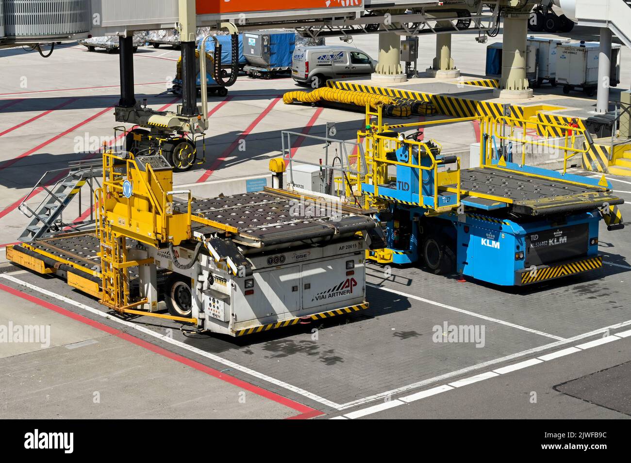 Amsterdam, Netherlands - August 2022: Air freight pallet loaders parked on the airport apron at Schipol airport Stock Photo