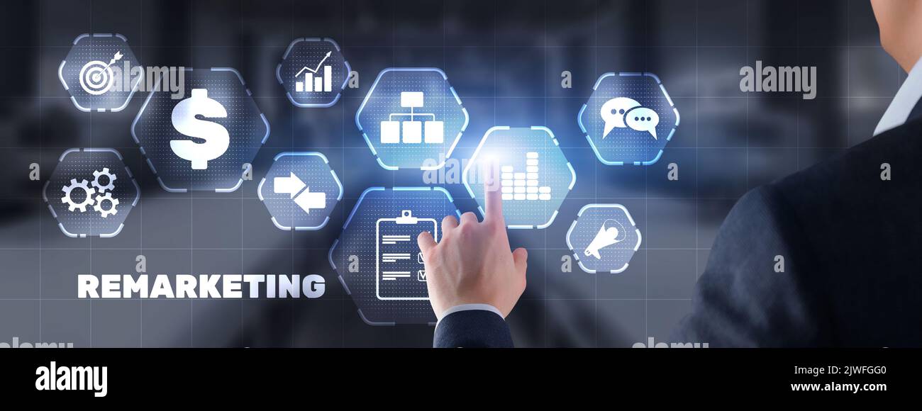 Remarketing digital marketing concept. Businessman presses remarketing on virtual screen. Stock Photo