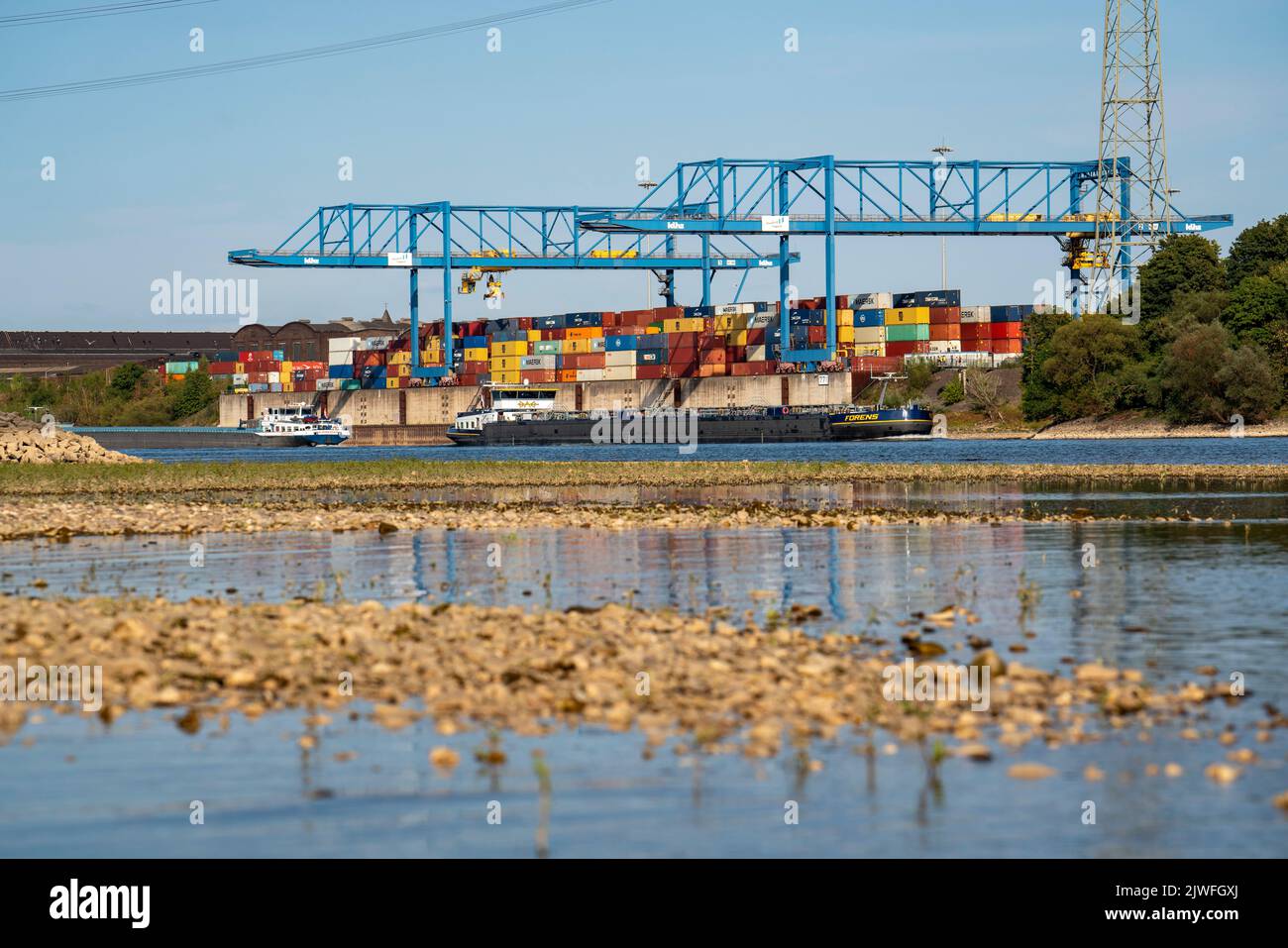 Container handling centre, Gateway West Terminal, Logport 2, cargo ship on the Rhine, at extremely low water, Duisburg, NRW, Germany Stock Photo