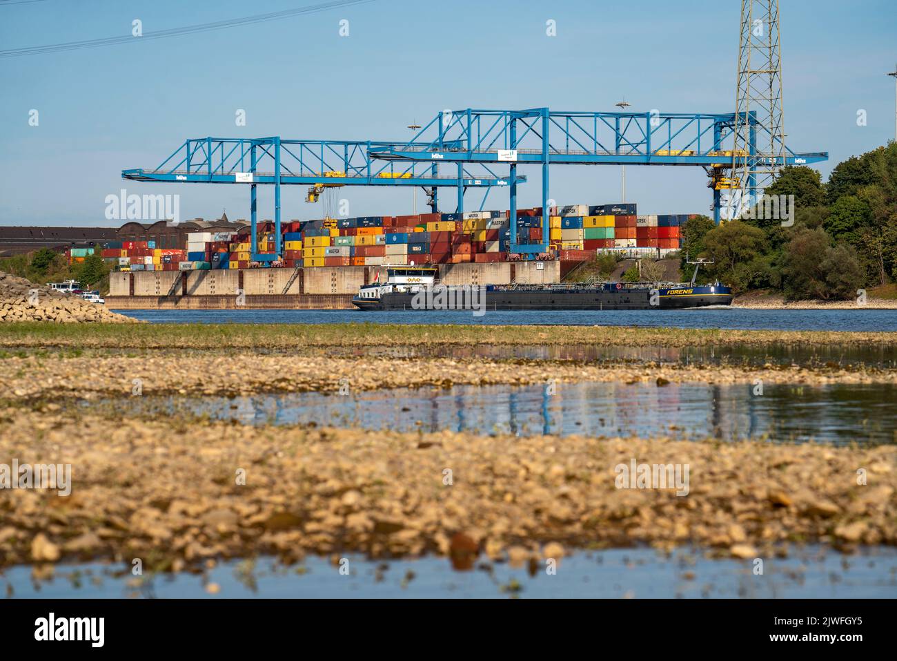 Container handling centre, Gateway West Terminal, Logport 2, cargo ship on the Rhine, at extremely low water, Duisburg, NRW, Germany Stock Photo