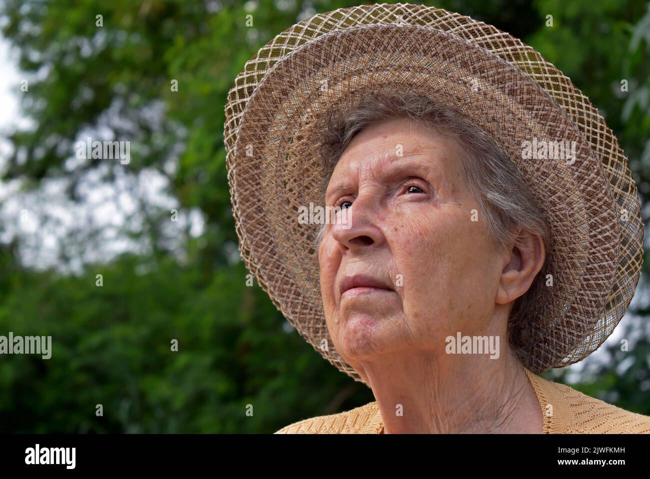 Elderly woman with suspicious look Stock Photo