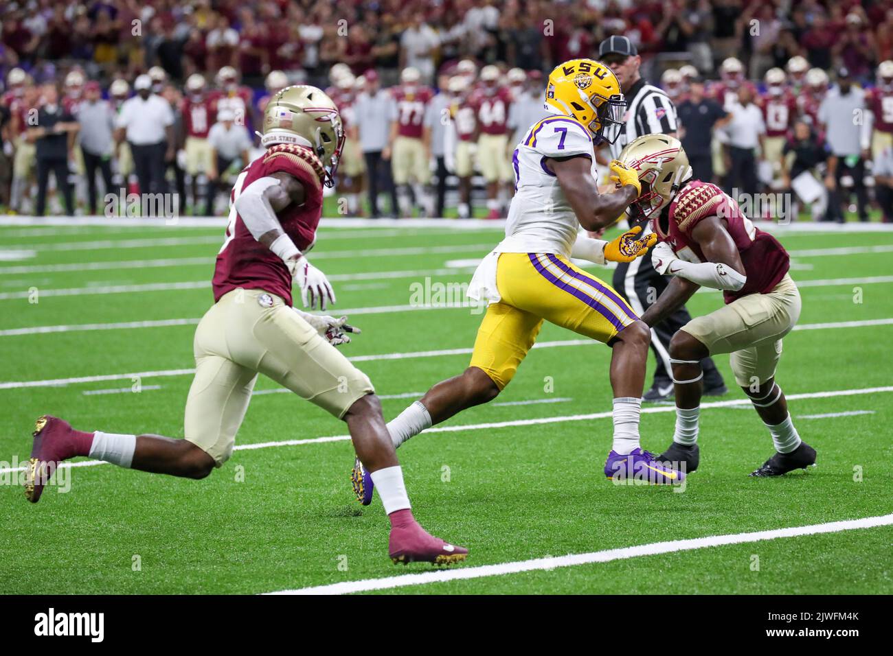 September 4, 2022: LSU wide receiver Kayshon Boutte (7) tries to bring in a pass between two Florida St. defenders during the Allstate Louisiana Kickoff Game between the Florida St. Seminoles and the LSU Tigers at the Caesars Superdome in New Orleans, LA. Jonathan Mailhes/CSM Stock Photo