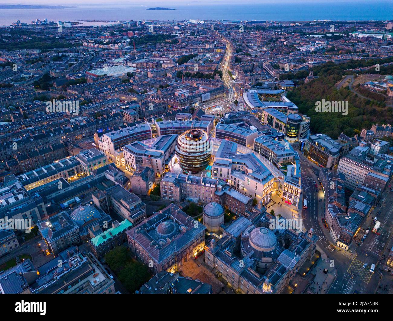 Aerial view at night of St James Quarter retail and residential