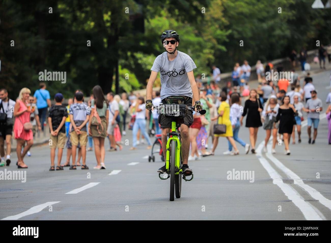 Kyiv, Ukraine 24 august, 2021 Young guy rides a bicycle on the road