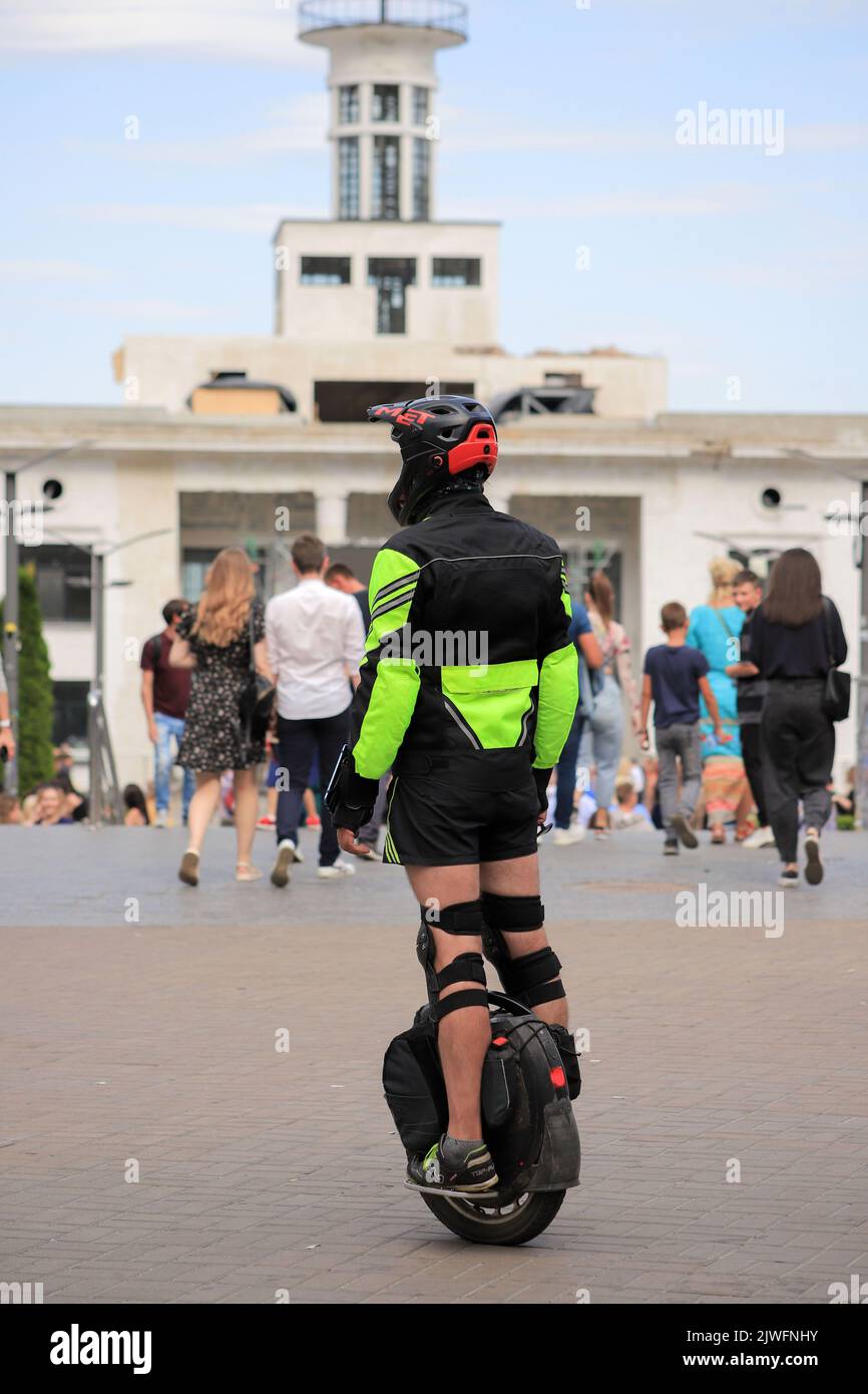 Rider in equipment on an electric unicycle Stock Photo