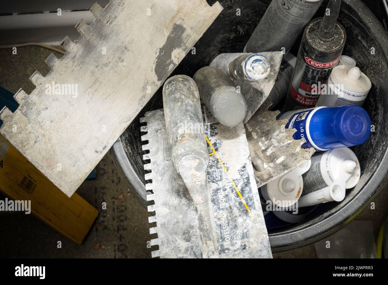 Mixing building tools in Bucket Stock Photo Alamy
