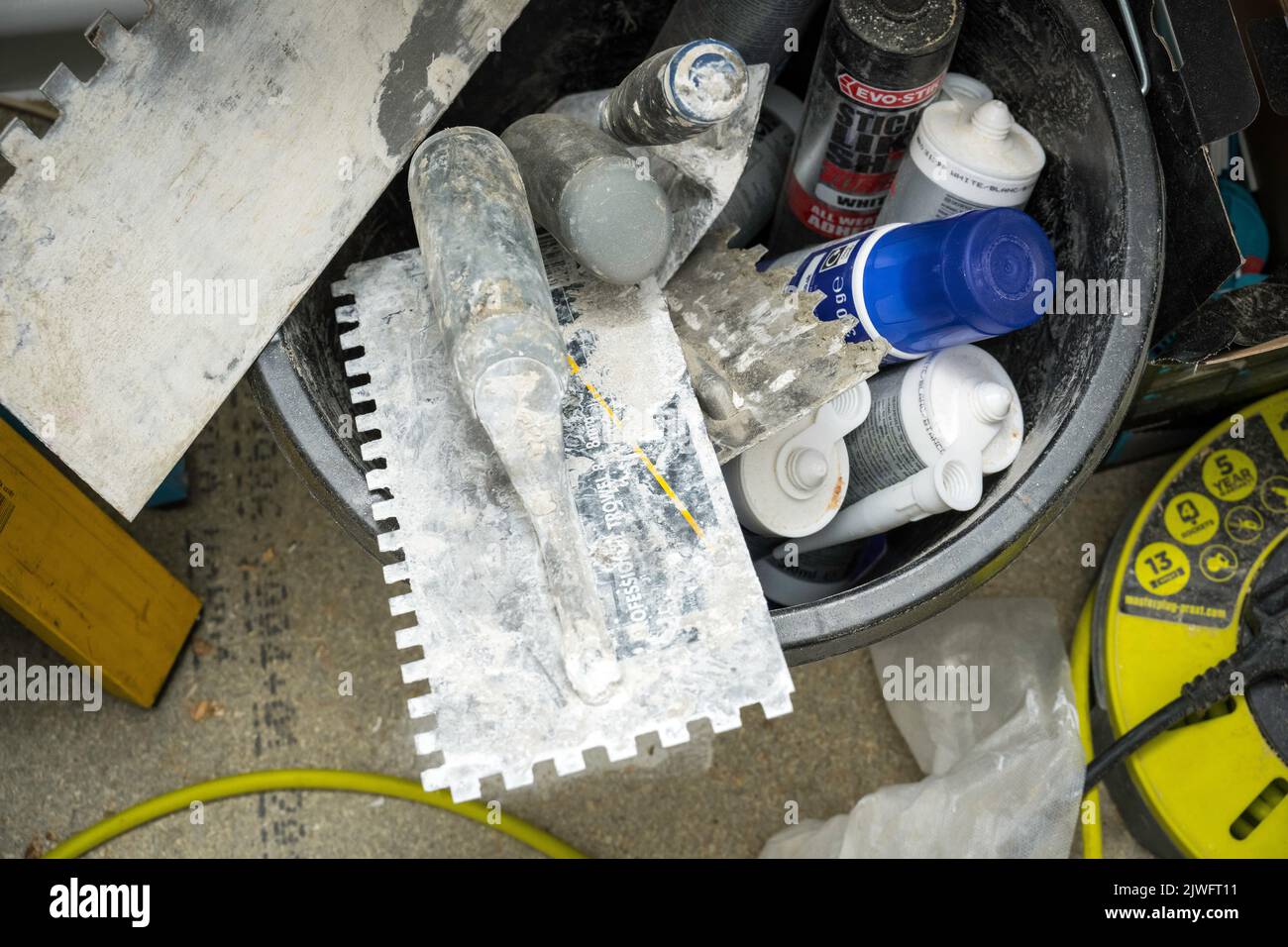 Mixing building tools in Bucket Stock Photo Alamy