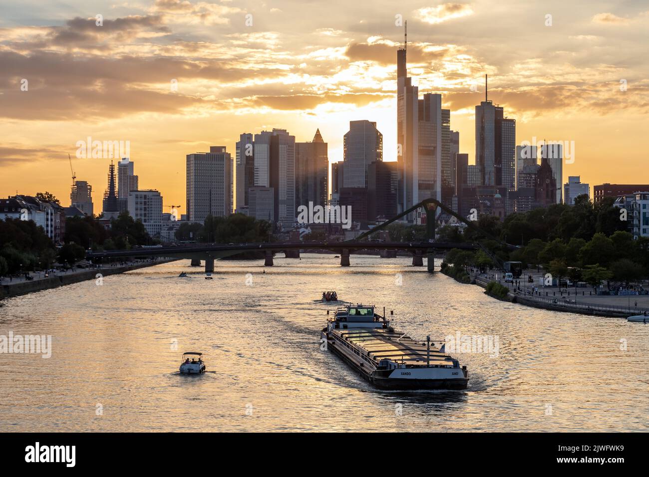 Barge on the Main River against the backdrop of the Frankfurt skyline Stock Photo