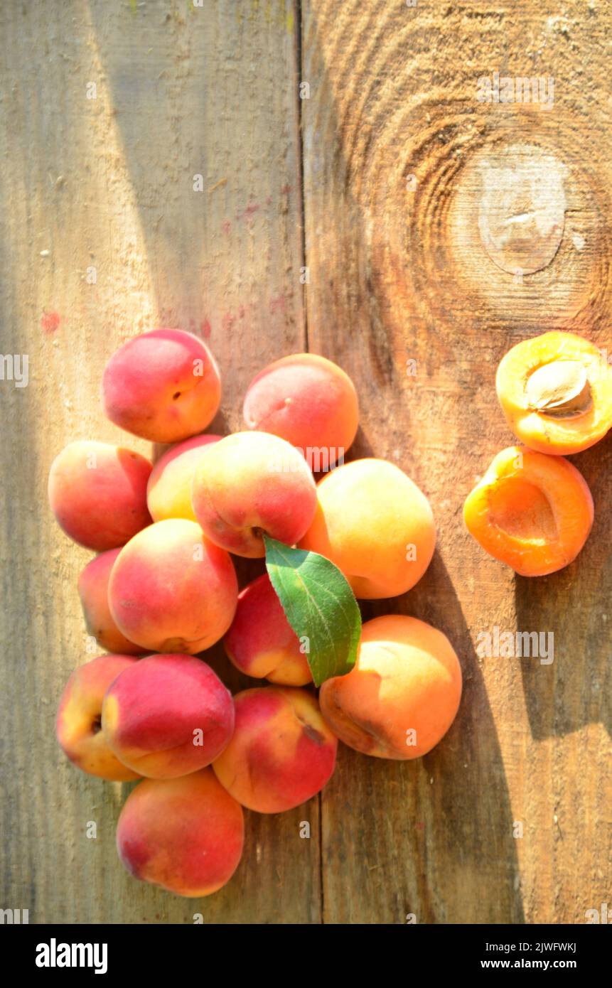 Peach jam in glass jar with peach wedges and whole fruit. Peach jam on