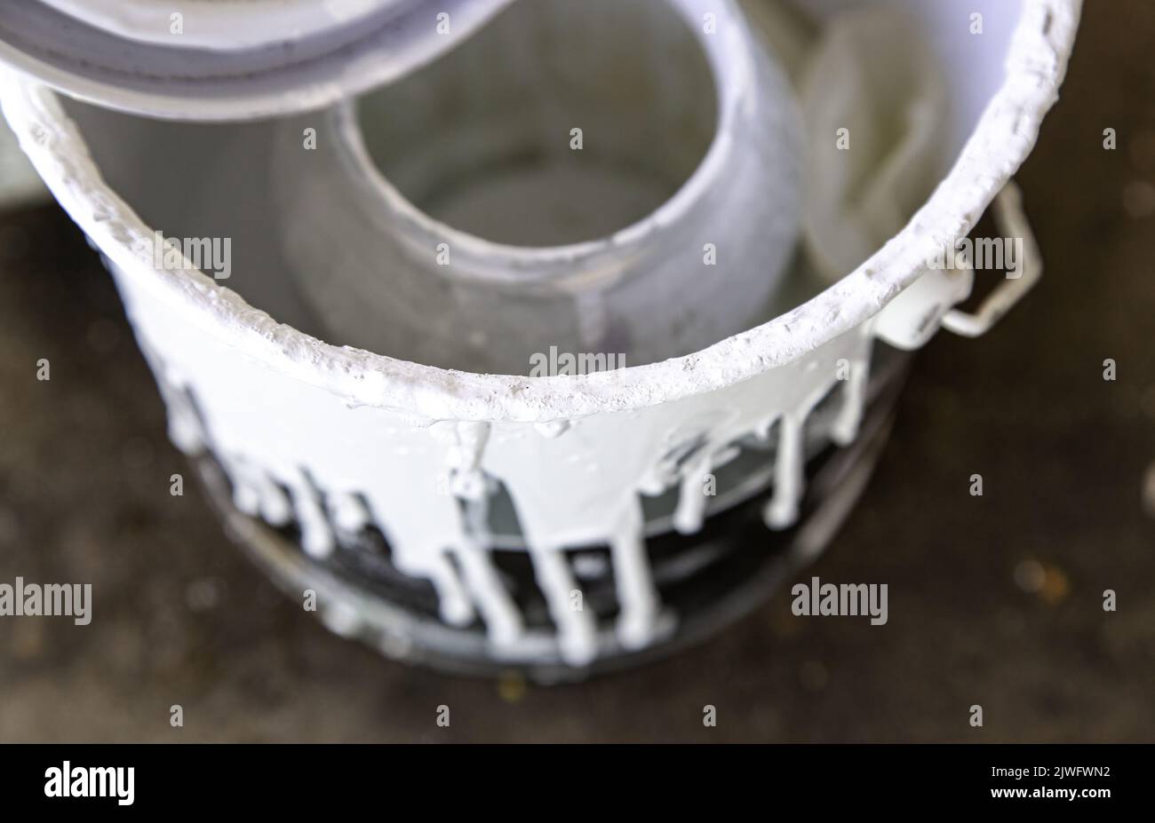 Detail of bucket stained with white paint, art and decoration Stock Photo