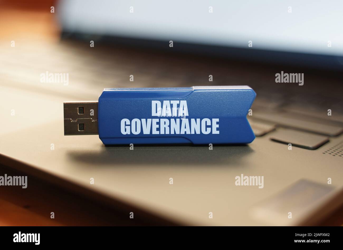 Computer and security concept. On the laptop keyboard is a flash drive