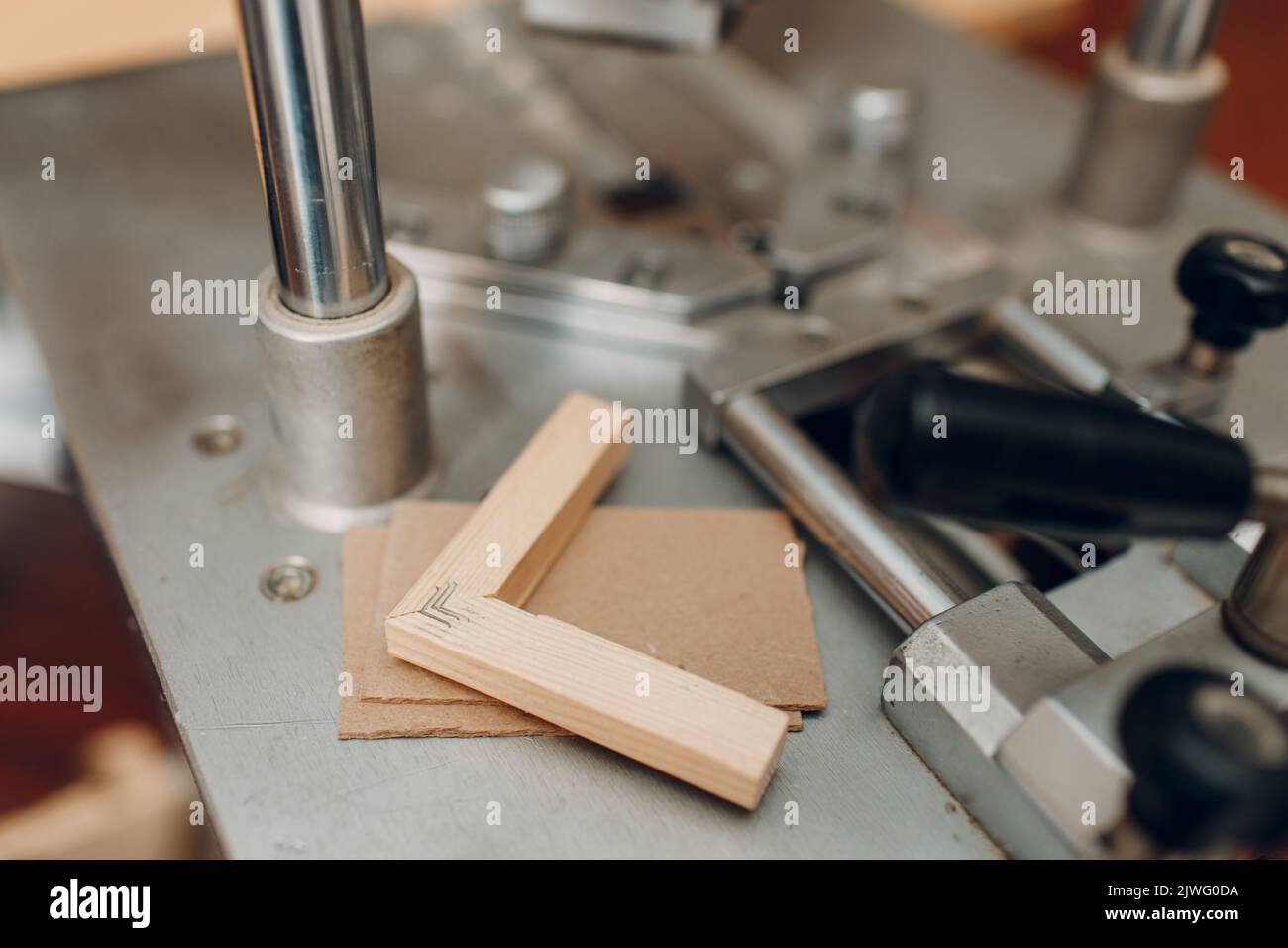 Framing Workshop assembling. Stapler ruler and frames baguette handmade  picture frame at studio table Stock Photo - Alamy