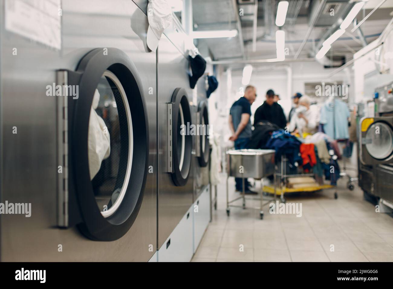 Dry cleaning clothes. Clean cloth chemical process. Laundry industrial