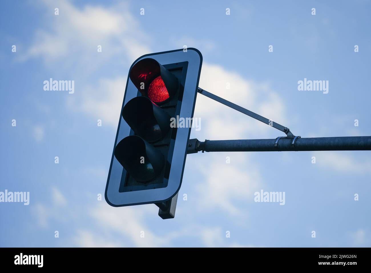 A low angle shot of a traffic light sign showing red Stock Photo - Alamy