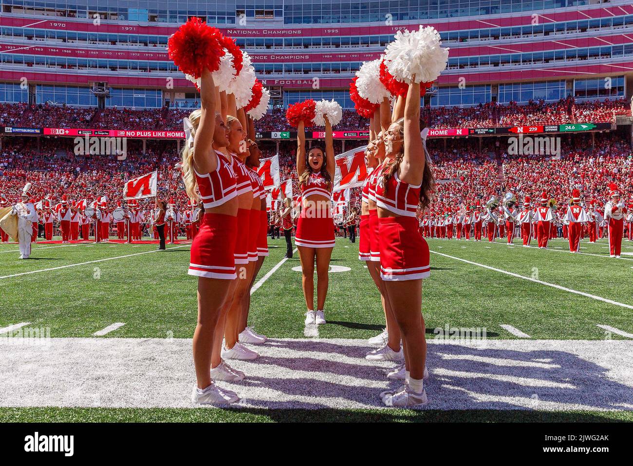 Lincoln, NE. U.S. 03rd Sep, 2022. Nebraska Cornhusker cheerleaders preform with the marching band before a NCAA Division 1 football game between North Dakota Fighting Hawks and the Nebraska Cornhuskers at Memorial Stadium in Lincoln, NE. Nebraska won 38-17.Attendance: 86,590.383rd consecutive sellout.Michael Spomer/Cal Sport Media/Alamy Live News Stock Photo
