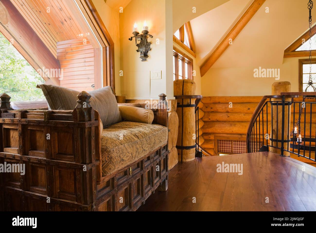Medieval style wooden sofa on the upstairs floor mezzanine inside