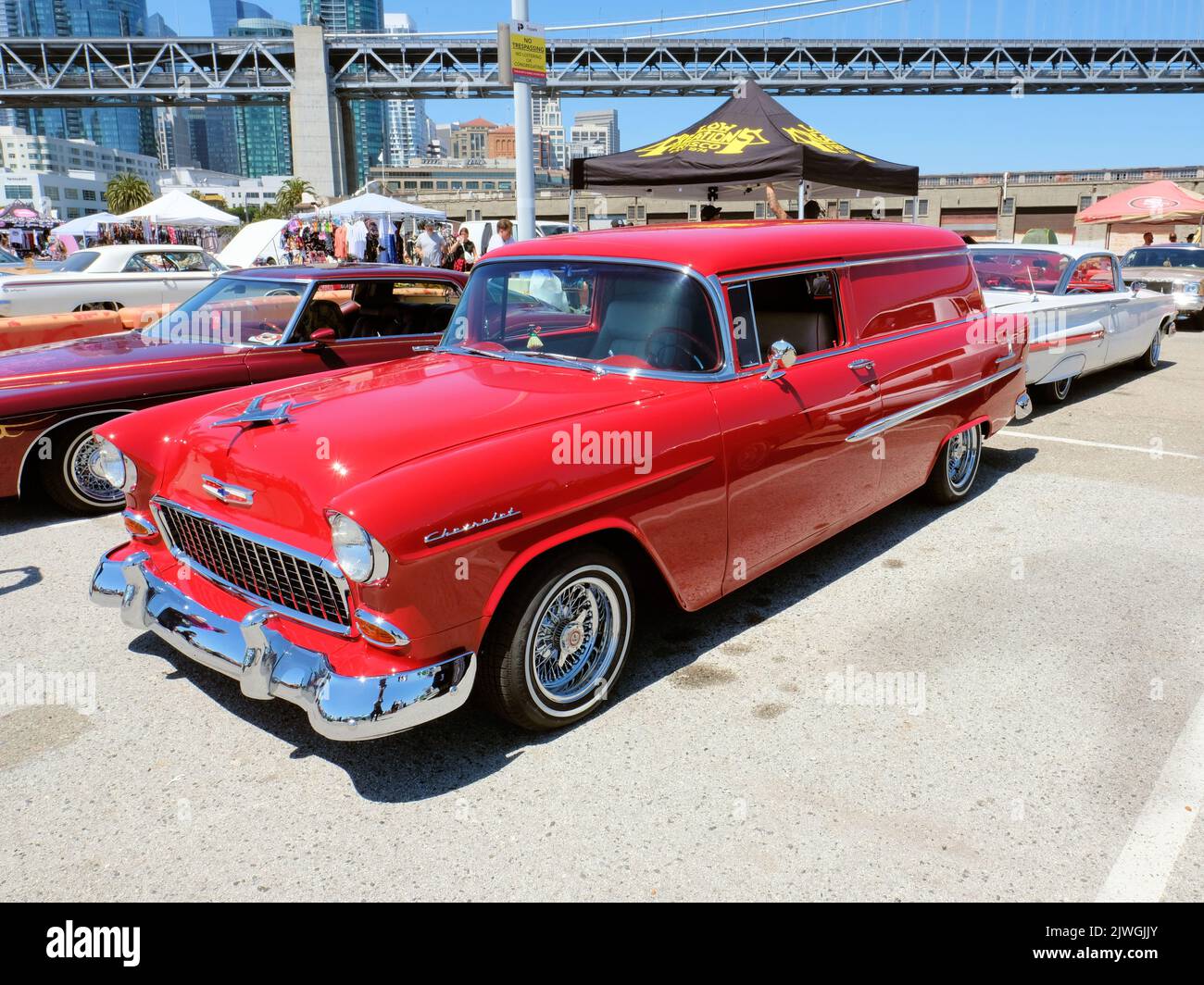 Red 1956 Handyman Chevy Station Wagon customized lowrider at a cars show in San Francisco, California; The Embarcadero. Stock Photo