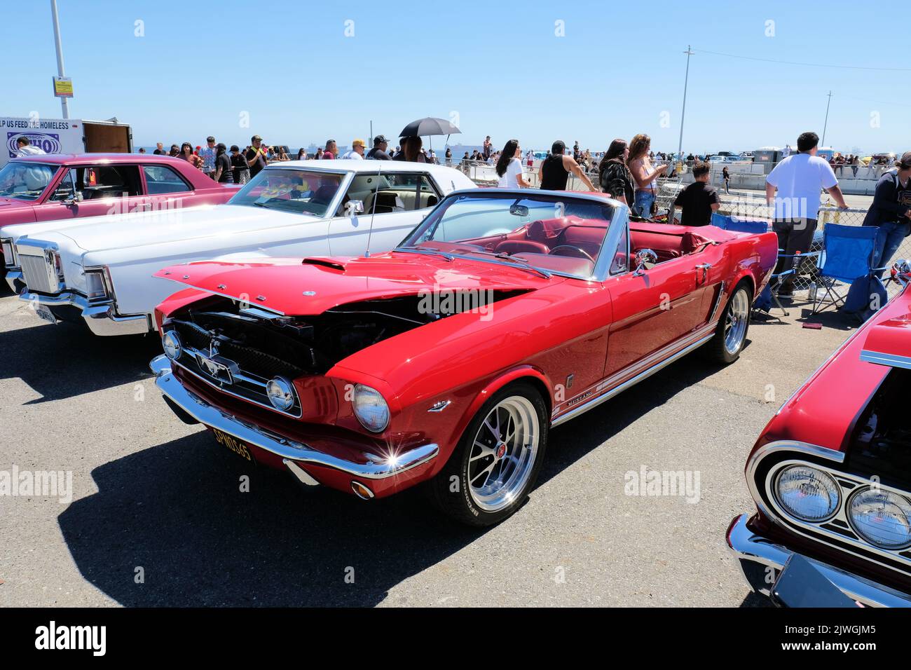 Red convertible 1965 Mustang with a 289 Windsor V8 (4.7 L) engine at a car show in San Francisco, California; classic American car, first generation. Stock Photo
