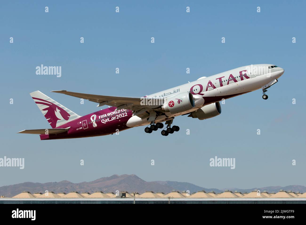 A Qatar Airways Boeing 777200LR in special livery 2022 Qatar football