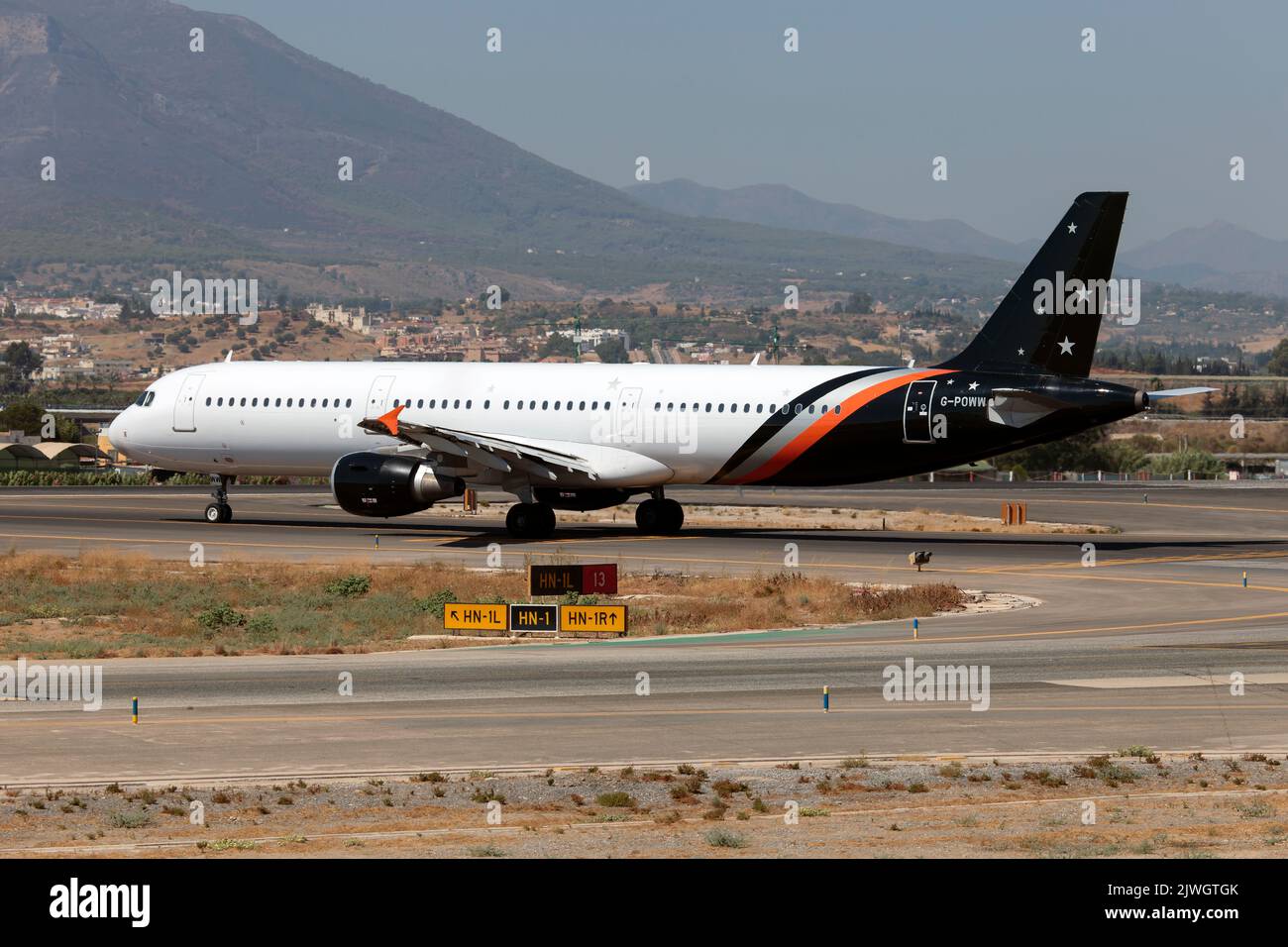 A Titan Airways Airbus 321 ready to leave Malaga Costa del sol airport.Titan Airways is a British charter airline based at London Stansted Airport. The carrier specialises in short-notice ACMI and wet lease operations as well as ad-hoc passenger and cargo charter services to tour operators, corporations, governments and the sports and entertainment sectors. Stock Photo