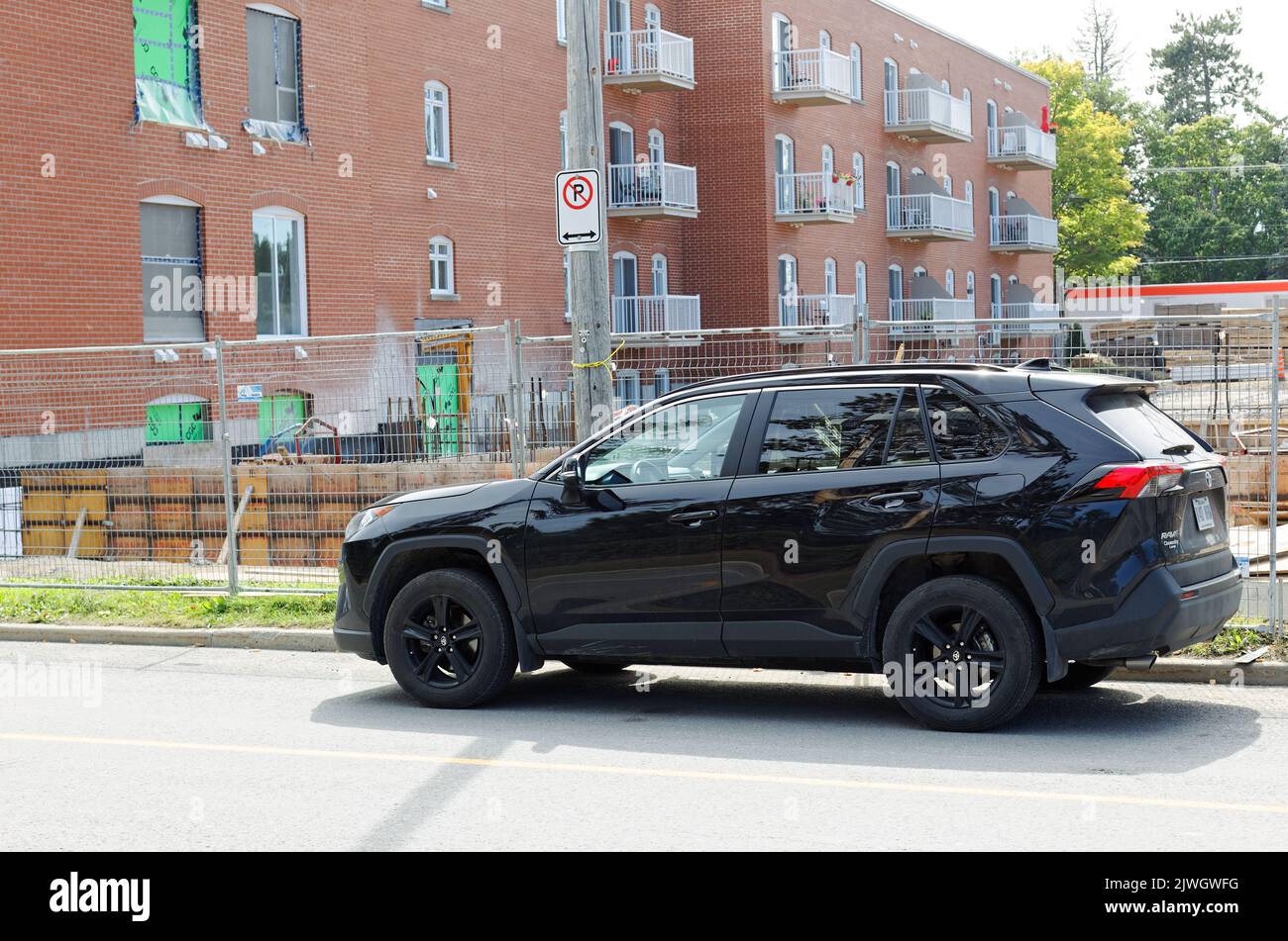 A black SUV parked in a no parking zone. Quebec,Canada Stock Photo