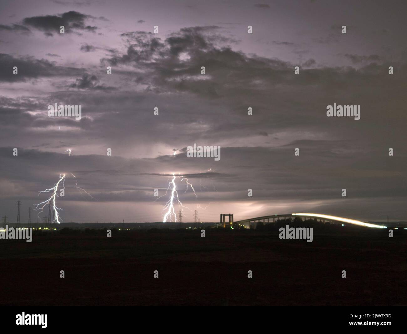 Minster on Sea, Kent, UK. 06th September, 2022. UK Weather: lightning seen during a thunderstorm near the Sheppey Crossing from Minster on Sea, Kent. Credit: James Bell/Alamy Live News Stock Photo
