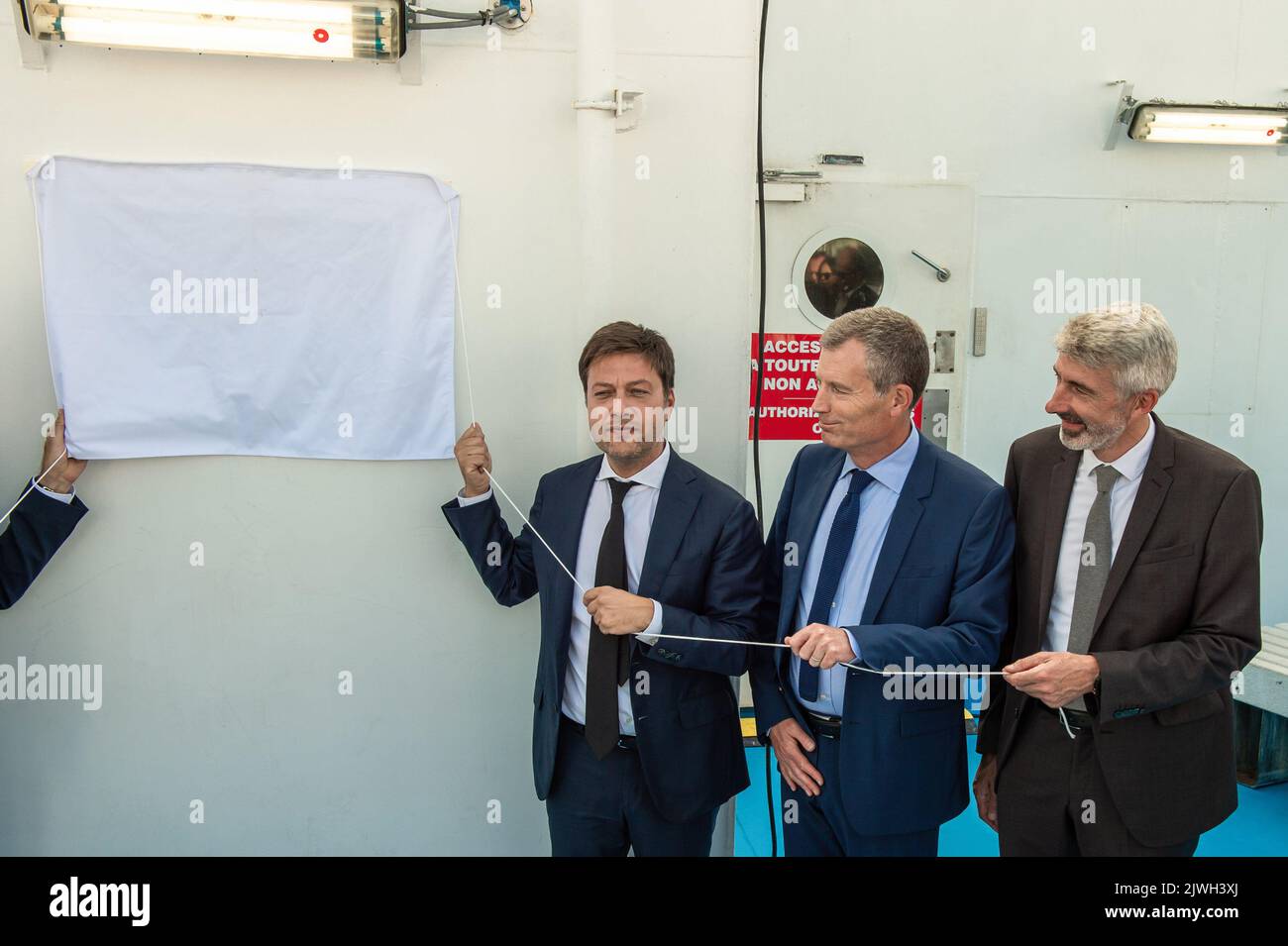 (from L to R) Benoit Payan (Marseille's mayor), Christophe Mirmand (Prefect) and Benoit Dehaye (CEO of La Meridonale Company) ready to unveil the inaugural plaque. The Piana is a ferry of the Compagnie Meridionale de Navigation (named La Meridionale) that connects Marseille to Ajaccio. After 5 years of studies and two years of field tests, it is the first ship in the world to be equipped with a particle filter technology that eliminates up to 99.9% of fine and superfine particles. Toxic emissions from shipping in Marseille are a major public health concern. This technology developed by CMN and Stock Photo