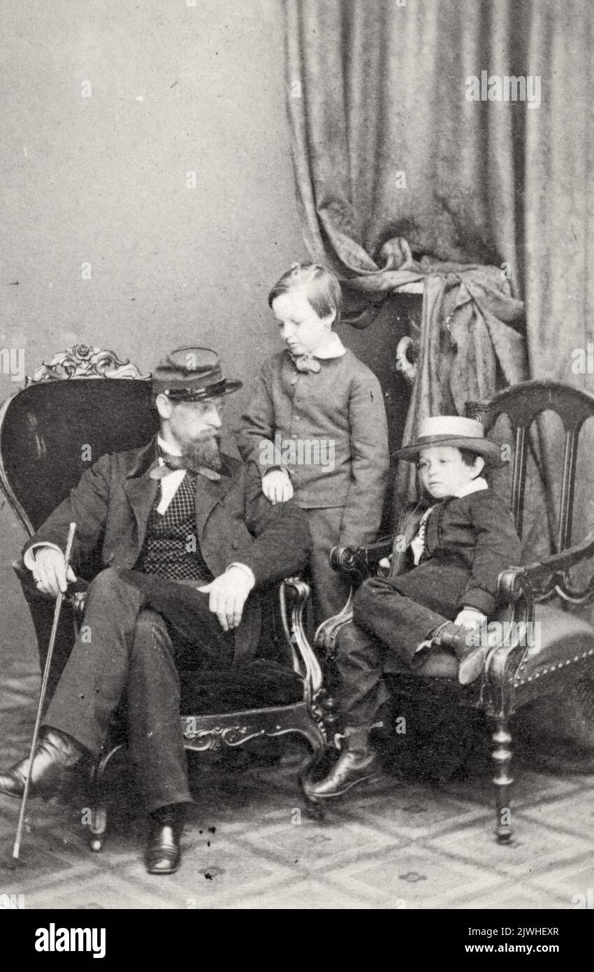 Willie and Tad Lincoln, sons of President Abraham Lincoln, with their cousin Lockwood Todd, Photo by Mathew Brady. Both these young boys would die before eaching adulyhood - Tad died at 18 (poosibly from TB) and William died at 12 from typhoid fever. Stock Photo