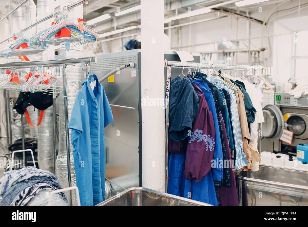 Dry cleaning clothes. Clean cloth chemical process. Laundry industrial