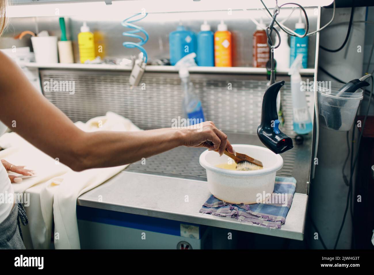 Dry cleaning clothes. Clean cloth chemical process. Laundry industrial