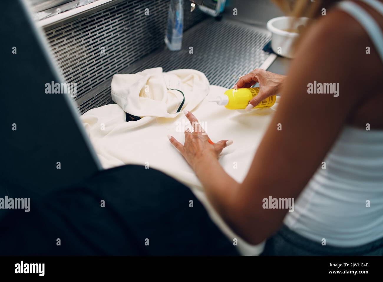 Dry cleaning clothes. Clean cloth chemical process. Laundry industrial