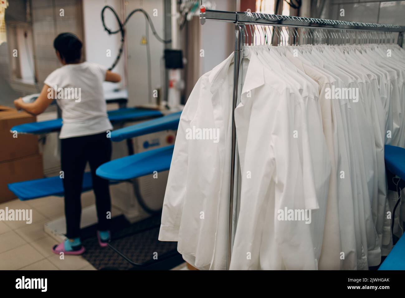 Dry cleaning clothes. Clean cloth chemical process. Laundry industrial