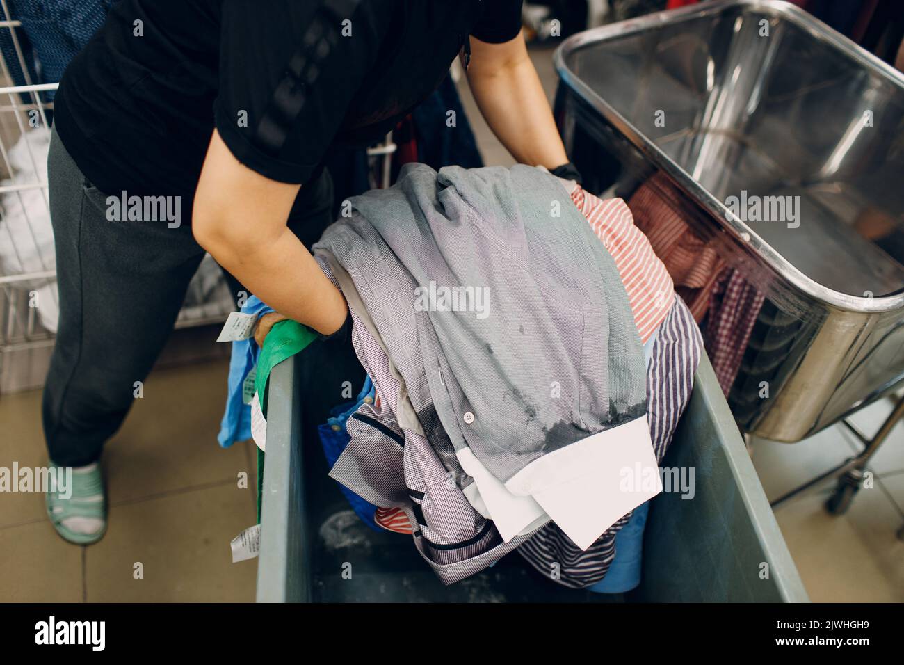 Dry cleaning clothes. Clean cloth chemical process. Laundry industrial