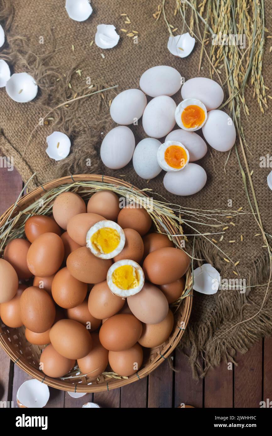 Hard-boiled chicken egg and its cross-section and soft-boiled duck egg