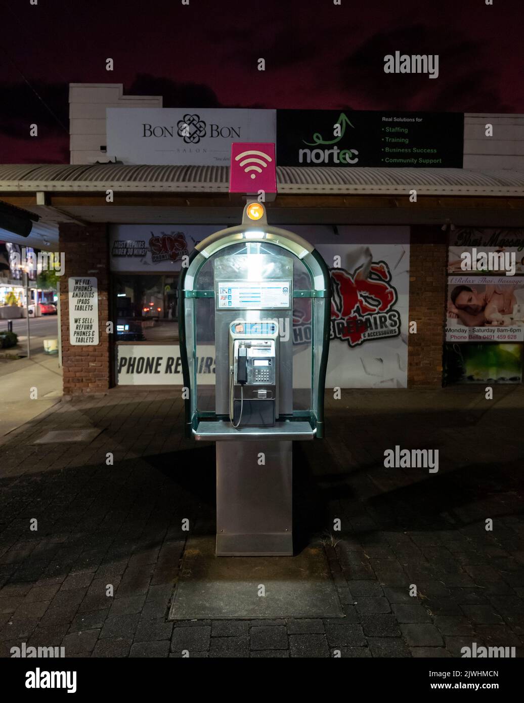 Telstra public phone booth in Palm Court, Murwillumbah, northern new south wales, australia, taken at night Stock Photo