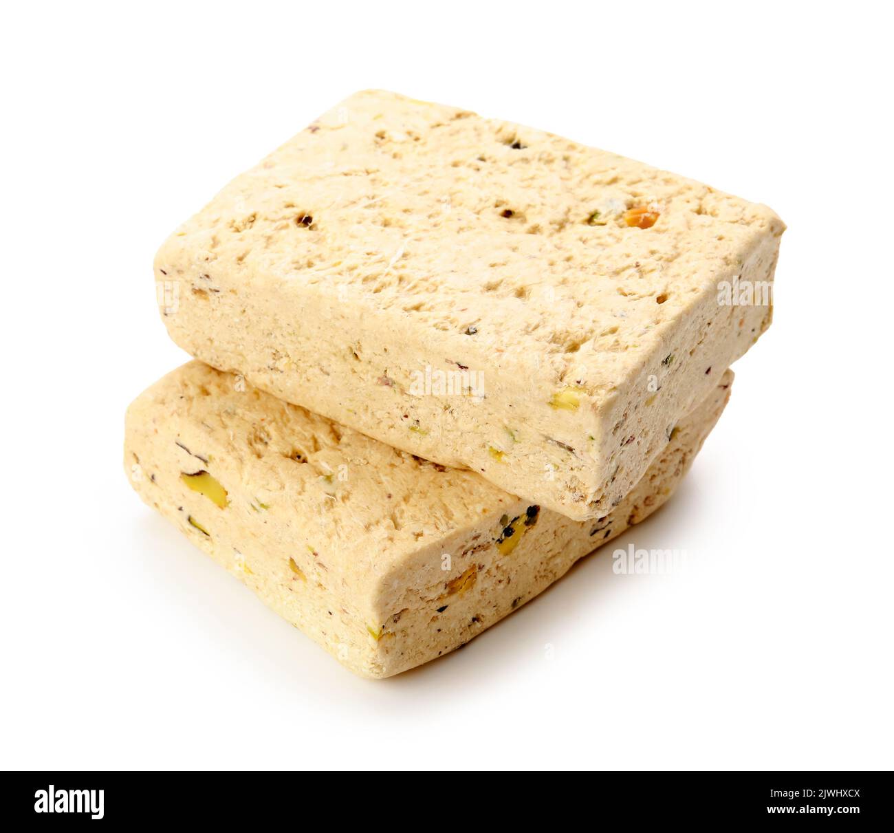 Pieces of delicious sesame halva on white background Stock Photo Alamy