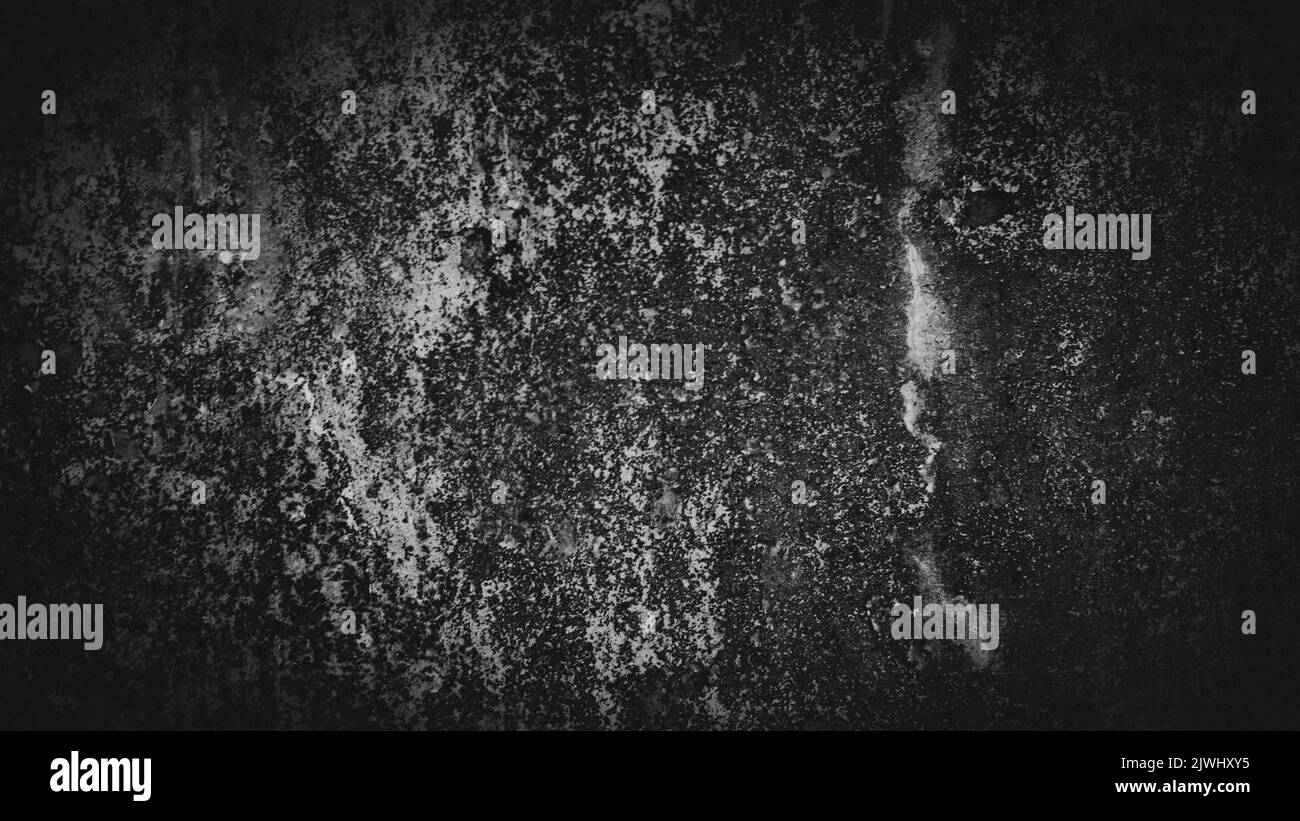 A black background of an old wall texture with grey marks and a copy