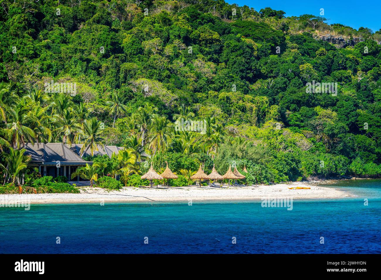 Bungalows on beach at tourist resort, Yasawa Islands, Fiji Stock Photo