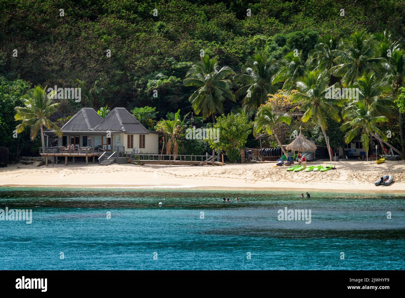 Bungalows on beach at tourist resort, Yasawa Islands, Fiji Stock Photo