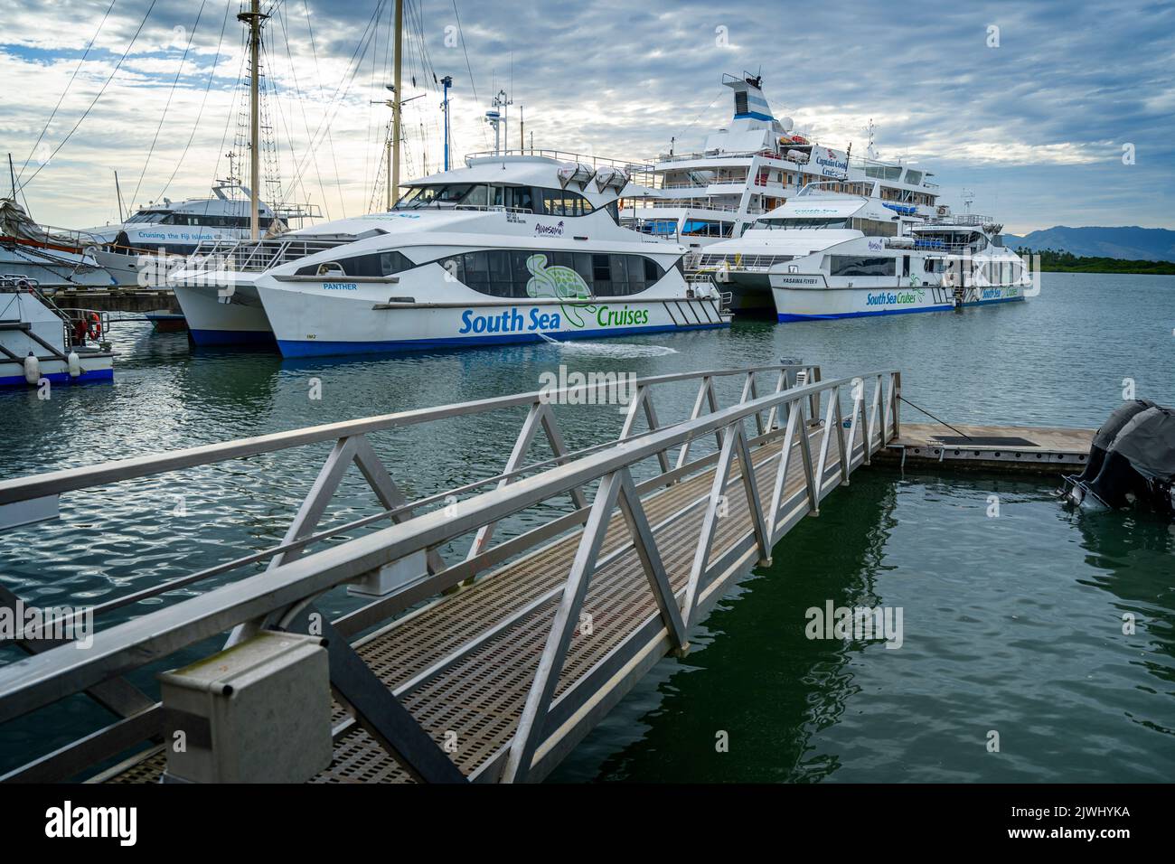 Tour boats and Island Ferries tied up at port facilities, Port Denarau Marina, Nadi, Fiji Stock Photo