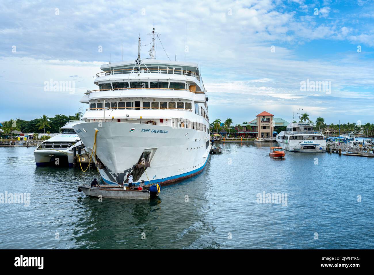 Tour boats and Island Ferries tied up at port facilities, Port Denarau Marina, Nadi, Fiji Stock Photo