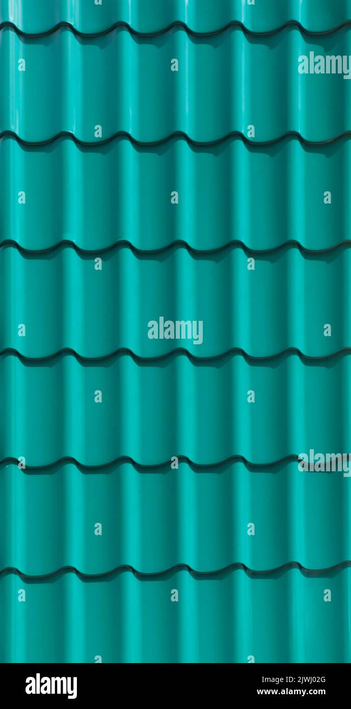 Green metal roofing shingles texture. Green metal roof tile background